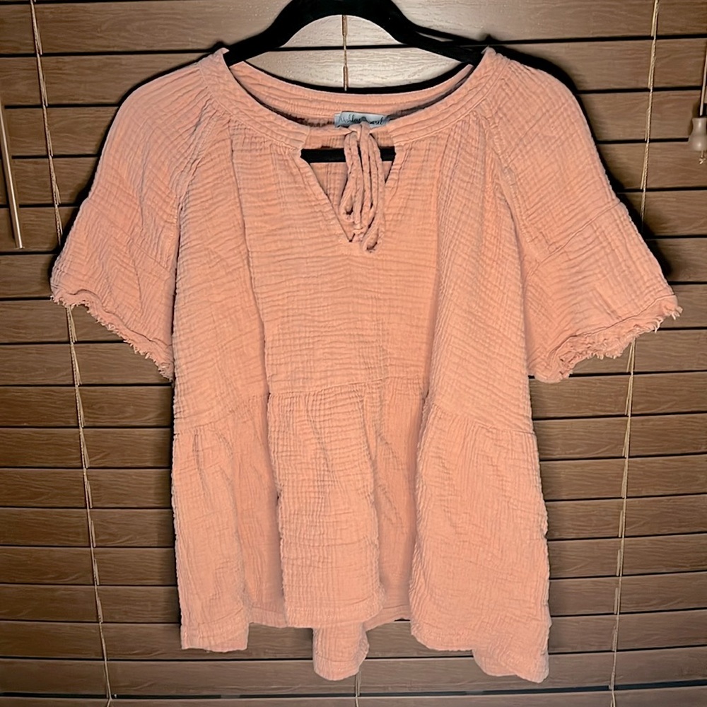 blush colored blouse, size small